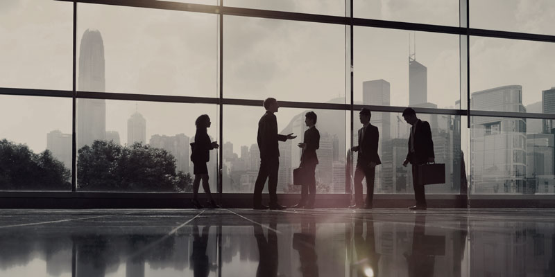 Business-people-in-front-of-glass-window